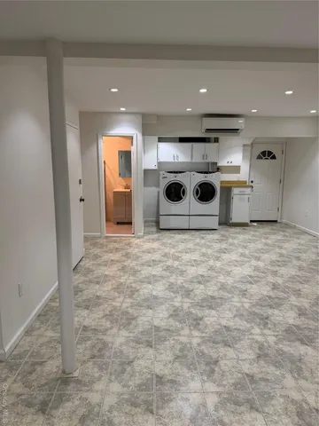a kitchen with a stove and a refrigerator