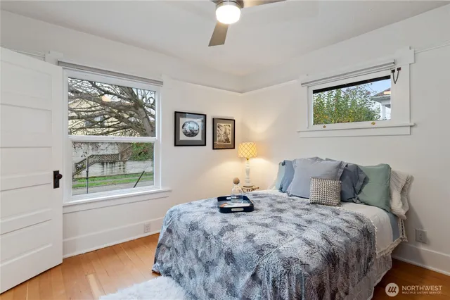 a bedroom with a bed and a window