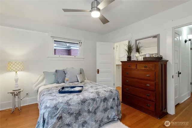 a bedroom with a bed and a dresser