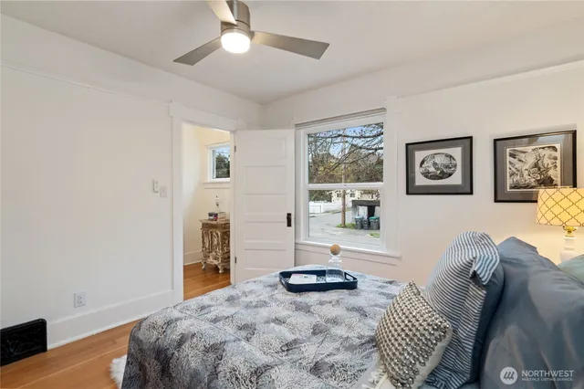 a bedroom with furniture and a wooden floor