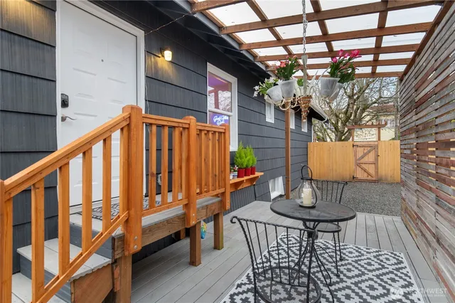 a balcony with table and chairs