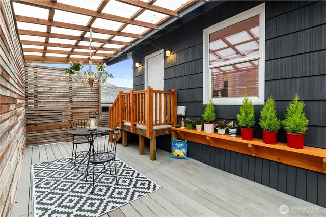 a view of a chairs and table in the balcony