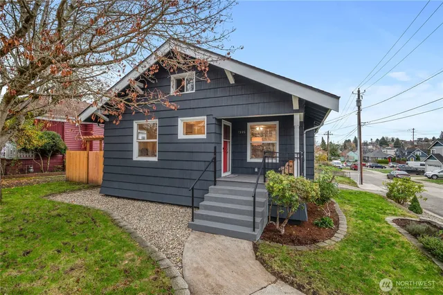 a front view of a house with garden