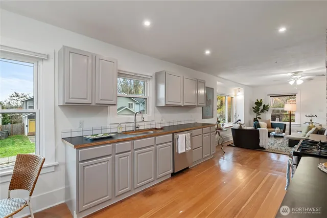 a large kitchen with lots of counter space and a sink