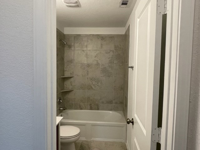 10413 Premier Park Street Austin, TX 78747 - Photo 16 of 24 a bathroom with a bathtub and a shower