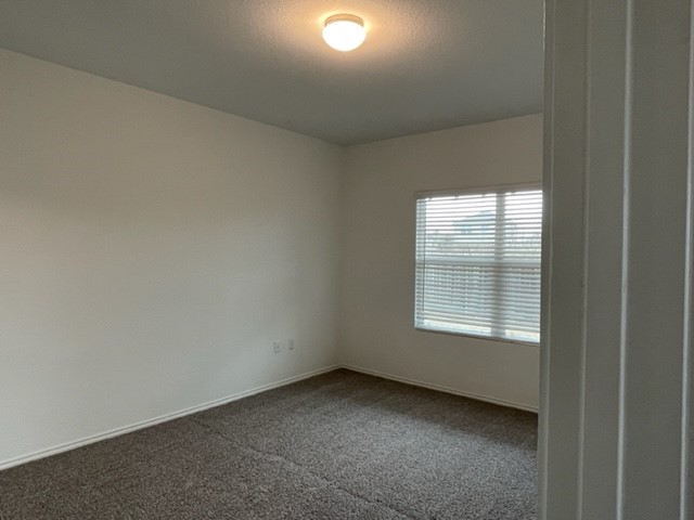 10413 Premier Park Street Austin, TX 78747 - Photo 18 of 24 an empty room with a window