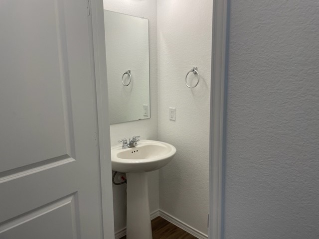 10413 Premier Park Street Austin, TX 78747 - Photo 10 of 24 a bathroom with a sink a mirror and toilet