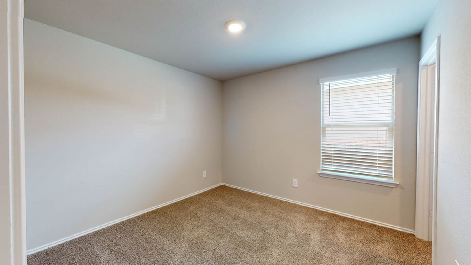 148 McNamara Court Jarrell, TX 76537 - Photo 17 of 22 Carpeted empty room featuring baseboards