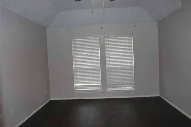 a bathroom with a granite countertop toilet and a bathtub