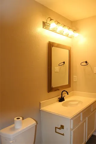 a view of a small space with wooden floor and a window