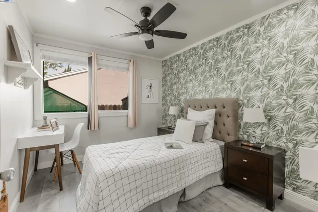 a bedroom with a bed and a table