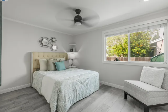 a bedroom with a bed and a couch