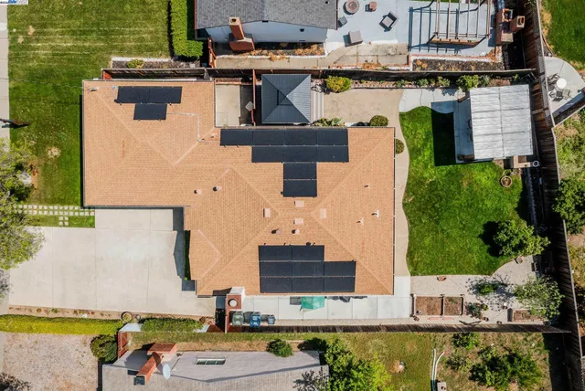 an aerial view of a house with swimming pool