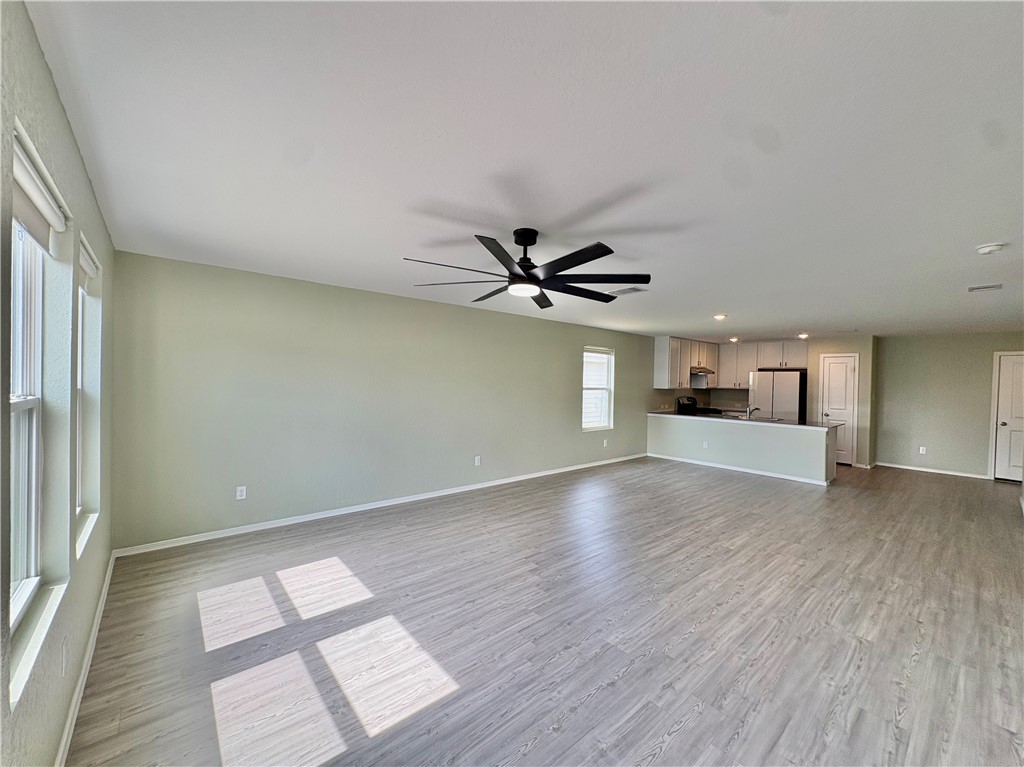 1109 Demeter Drive Portland, TX 78374 - Photo 8 of 18 wooden floor in an empty room with a window