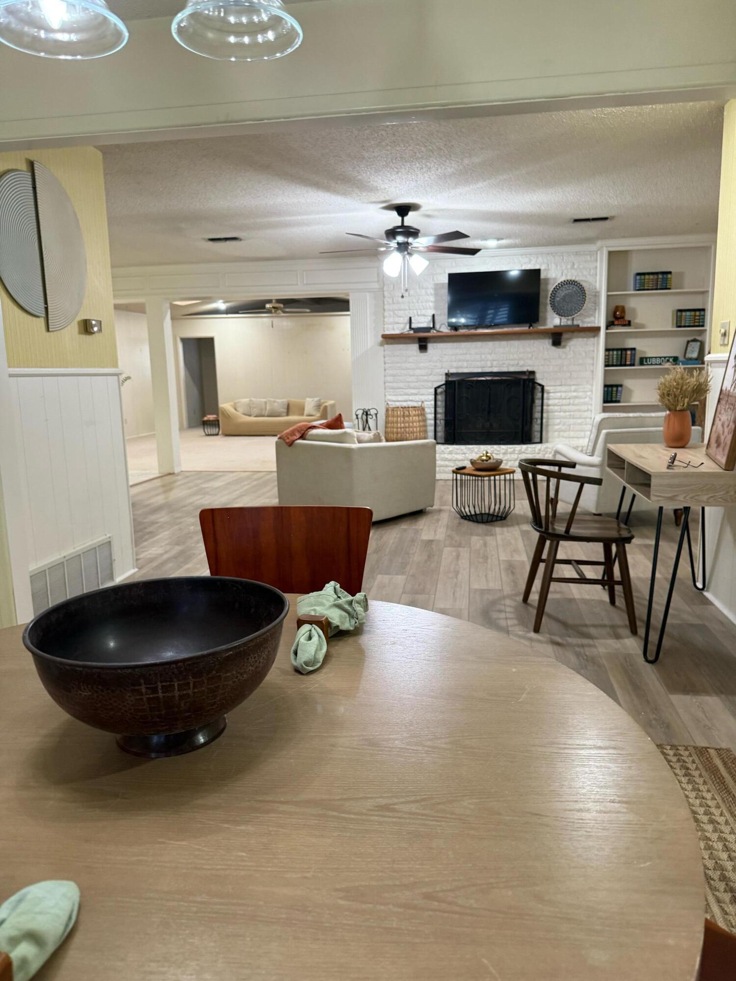 3012 69th Street Lubbock, TX 79413 - Photo 11 of 38 a living room with furniture and a flat screen tv