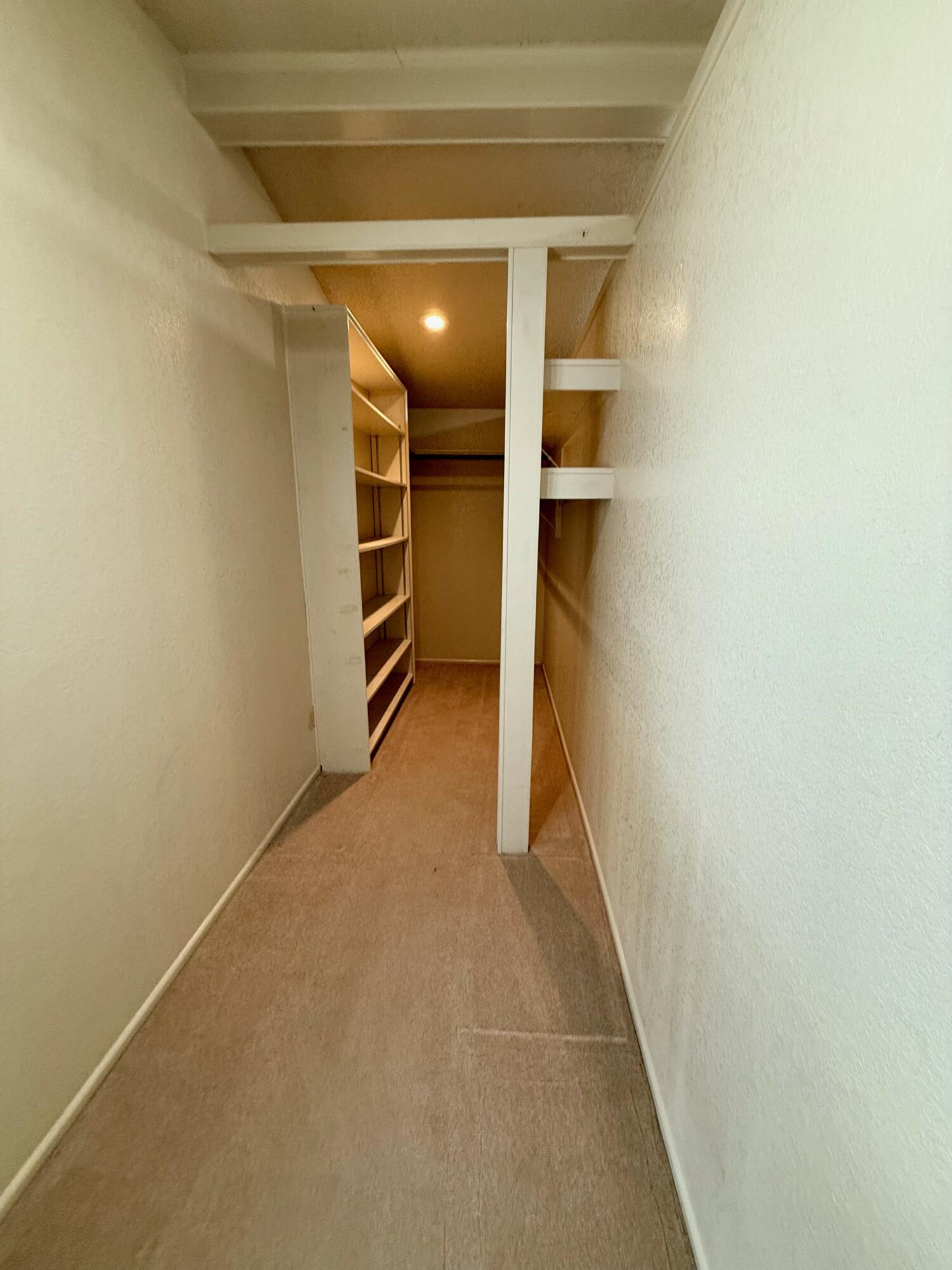 3012 69th Street Lubbock, TX 79413 - Photo 13 of 38 a view of an empty walk in closet