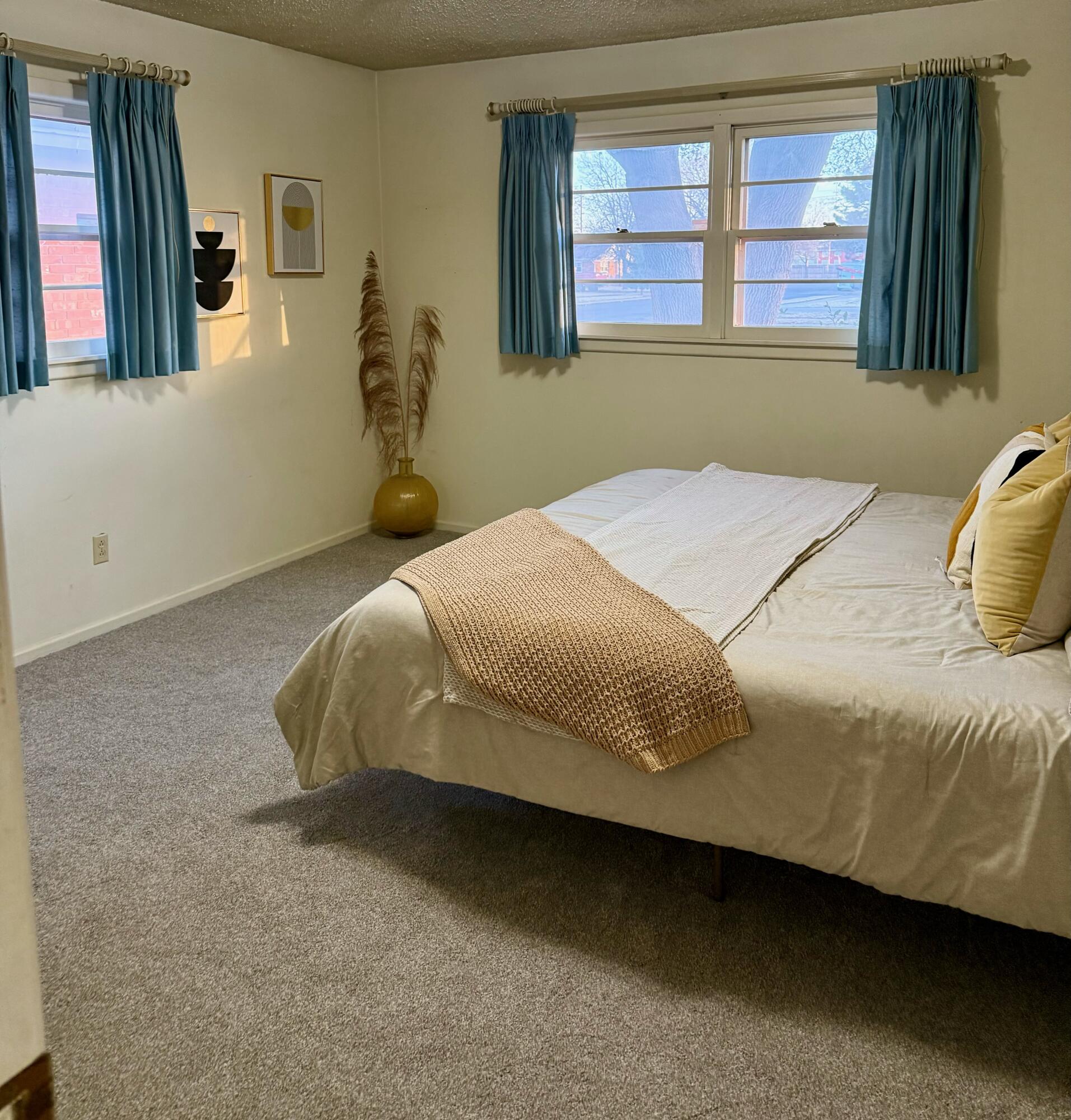 3012 69th Street Lubbock, TX 79413 - Photo 20 of 38 a bedroom with a bed and window