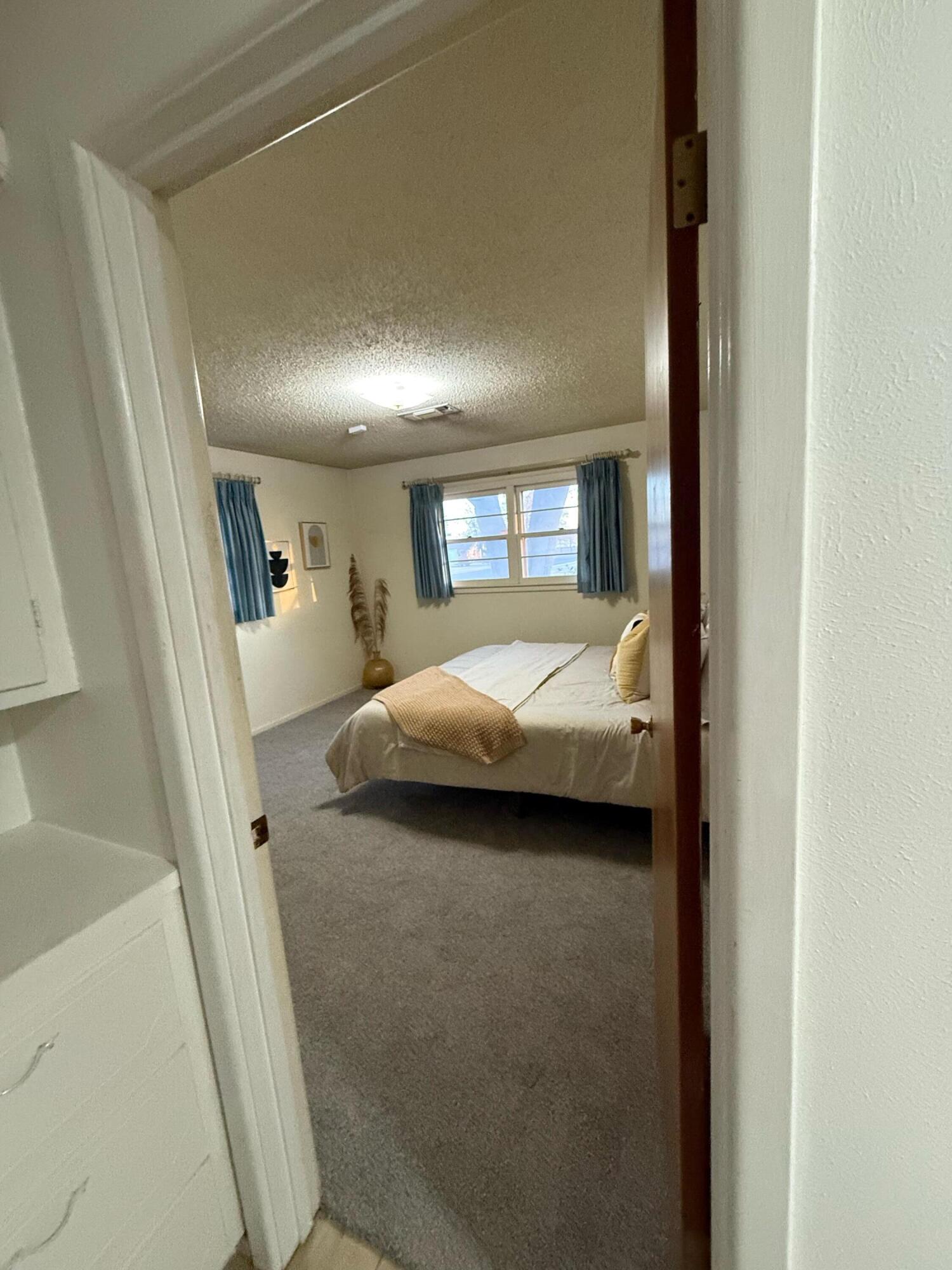 3012 69th Street Lubbock, TX 79413 - Photo 21 of 38 a bedroom with a bed and a window