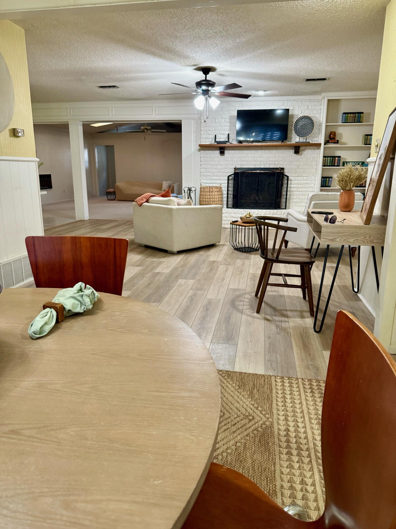 3012 69th Street Lubbock, TX 79413 - Photo 6 of 38 a living room with furniture and flat screen tv