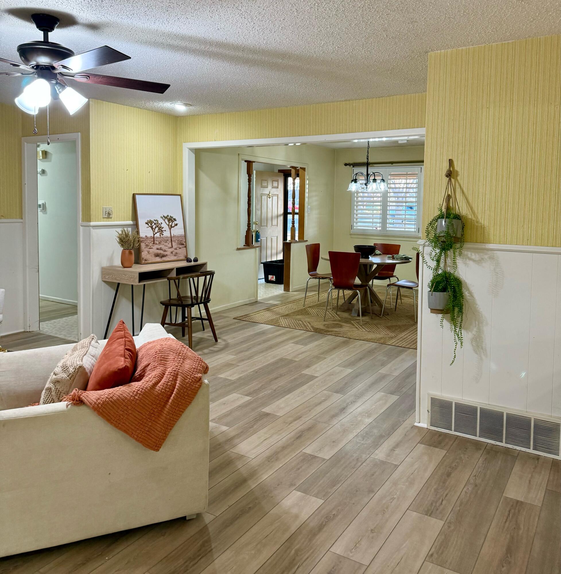 3012 69th Street Lubbock, TX 79413 - Photo 8 of 38 a living room with furniture and a wooden floor