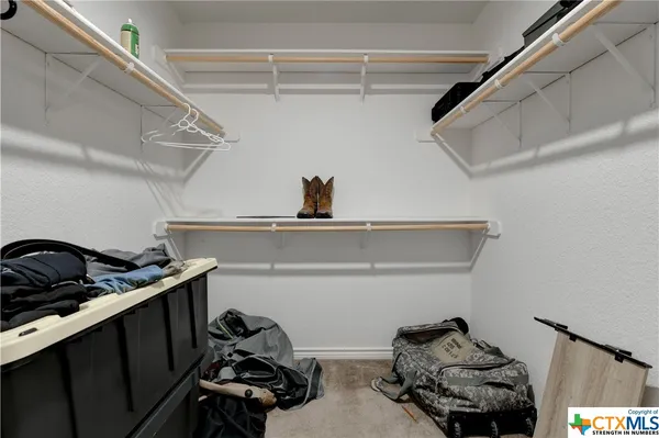 a close view of shoes stand and cabinets