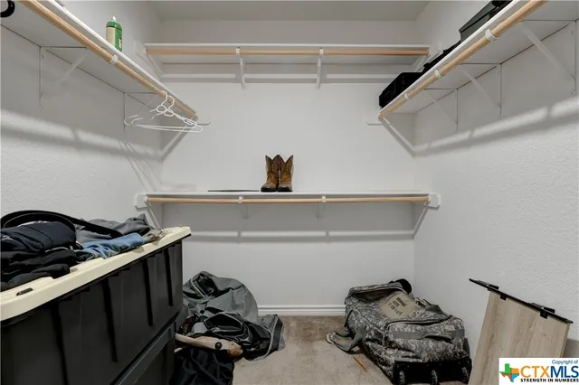 a close view of shoes stand and cabinets