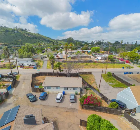a aerial view of a house with a yard