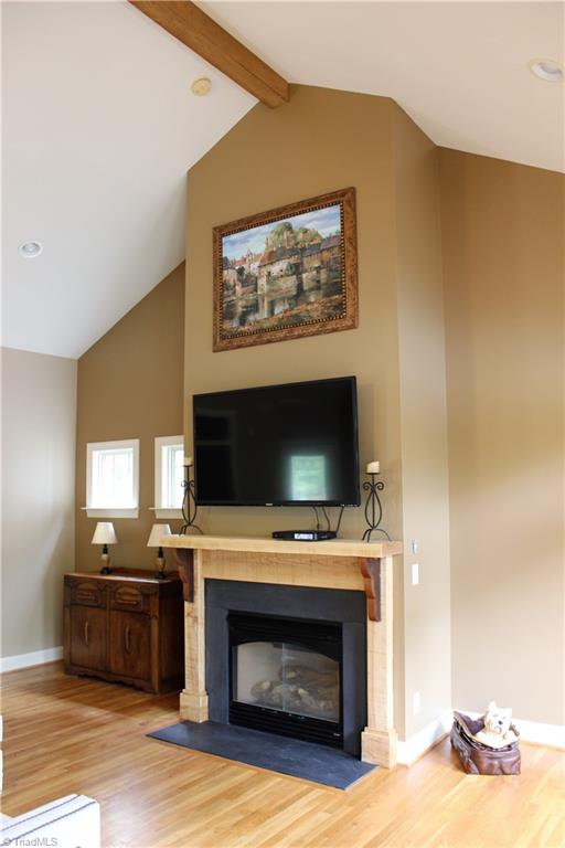 8267 Coldwater Road Stokesdale, NC 27357 - Photo 4 of 30 Custom Built Hickory & Walnut Mantel Surround & Hickory Beam!