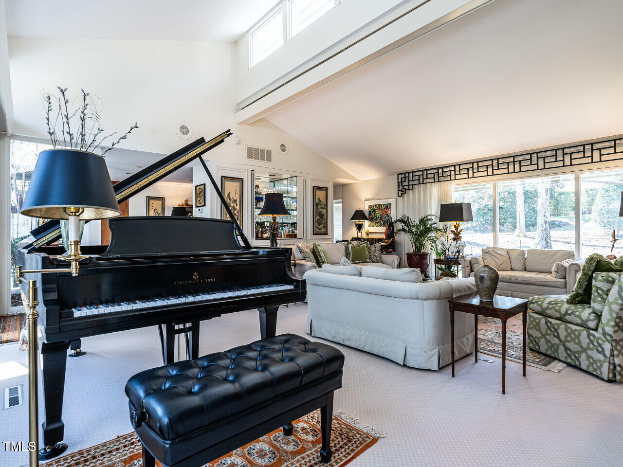 3206 Sussex Road Raleigh, NC 27612 - Photo 16 of 51 a living room with furniture and a piano