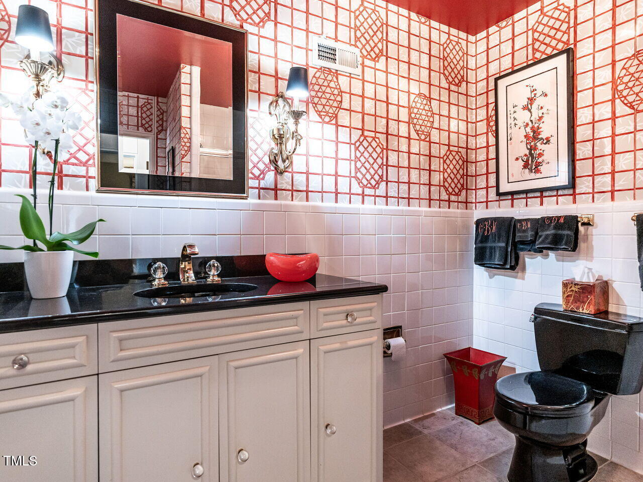 3206 Sussex Road Raleigh, NC 27612 - Photo 29 of 51 a kitchen with a sink and cabinets