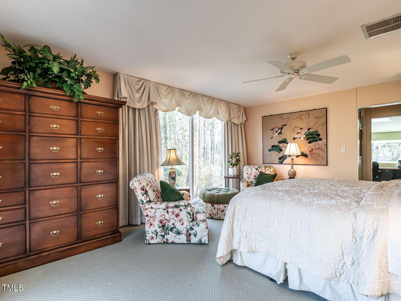 3206 Sussex Road Raleigh, NC 27612 - Photo 30 of 51 a spacious bedroom with a bed dresser and a window