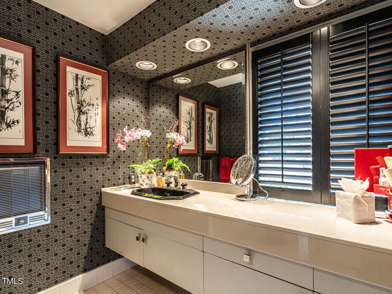 3206 Sussex Road Raleigh, NC 27612 - Photo 36 of 51 a bathroom with a sink and a mirror