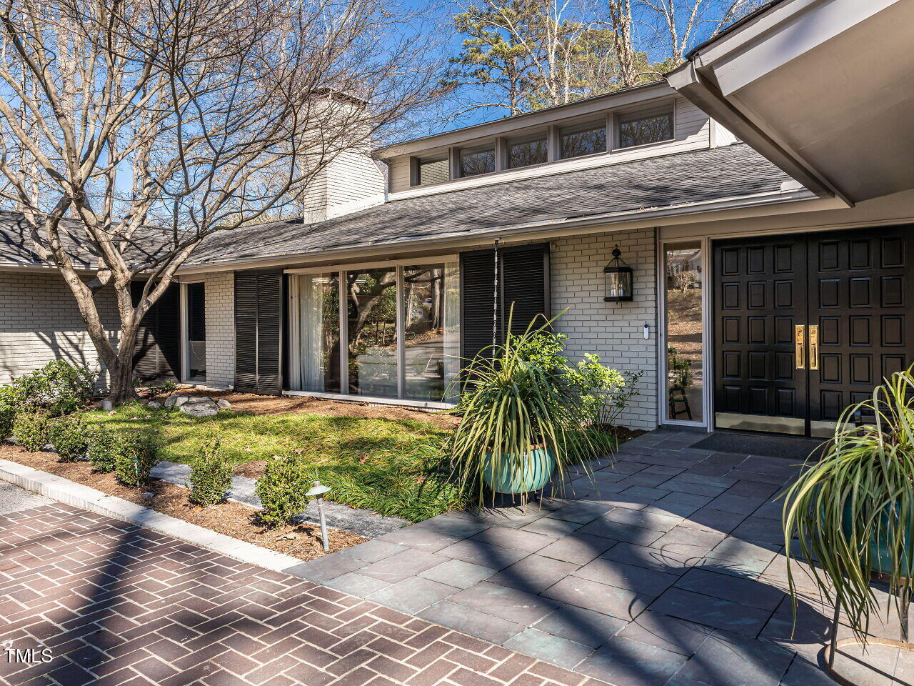 3206 Sussex Road Raleigh, NC 27612 - Photo 4 of 51 a front view of house with yard and outdoor seating