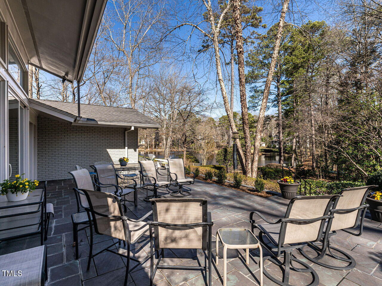 3206 Sussex Road Raleigh, NC 27612 - Photo 41 of 51 a view of patio with table and chairs and potted plants