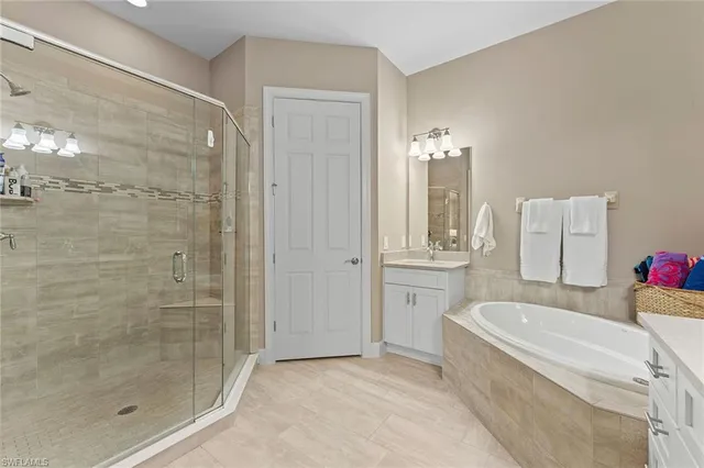 a bathroom with a bathtub and shower