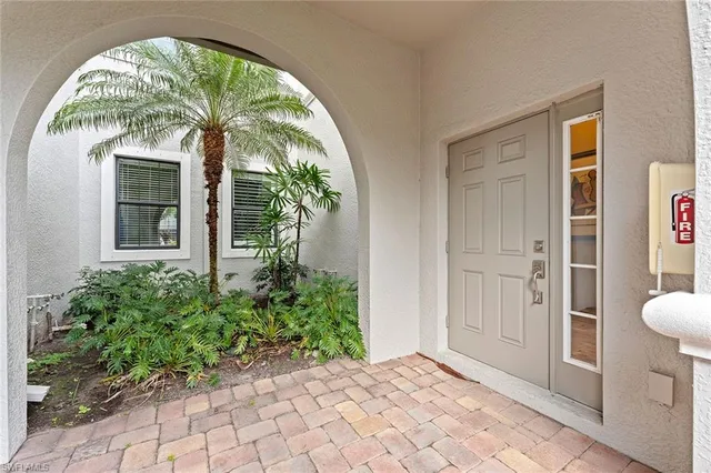 a view of entrance door with wooden floor