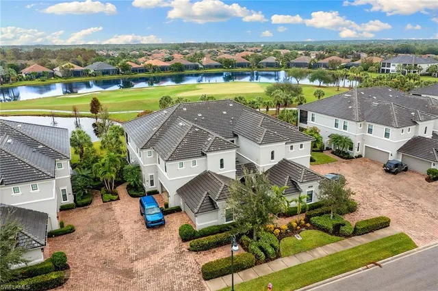 an aerial view of a house with a ocean view