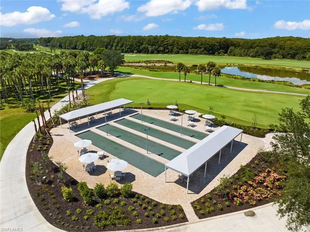 a view of a golf course with a big yard