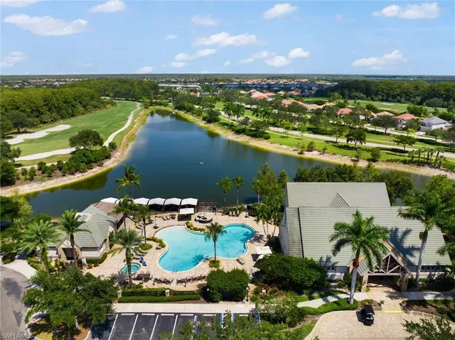 a view of swimming pool with outdoor seating