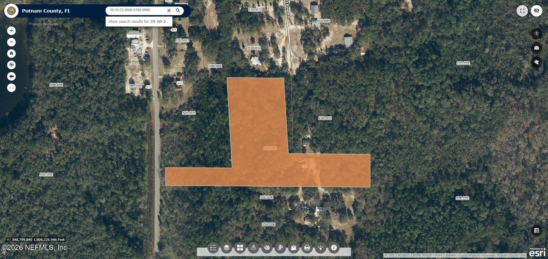136 Short Pine Road Hawthorne, FL 32640 - Photo 32 of 39 an aerial view of a house with a yard and tree s