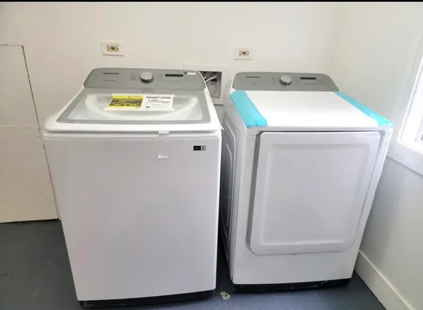 a utility room with dryer and washer