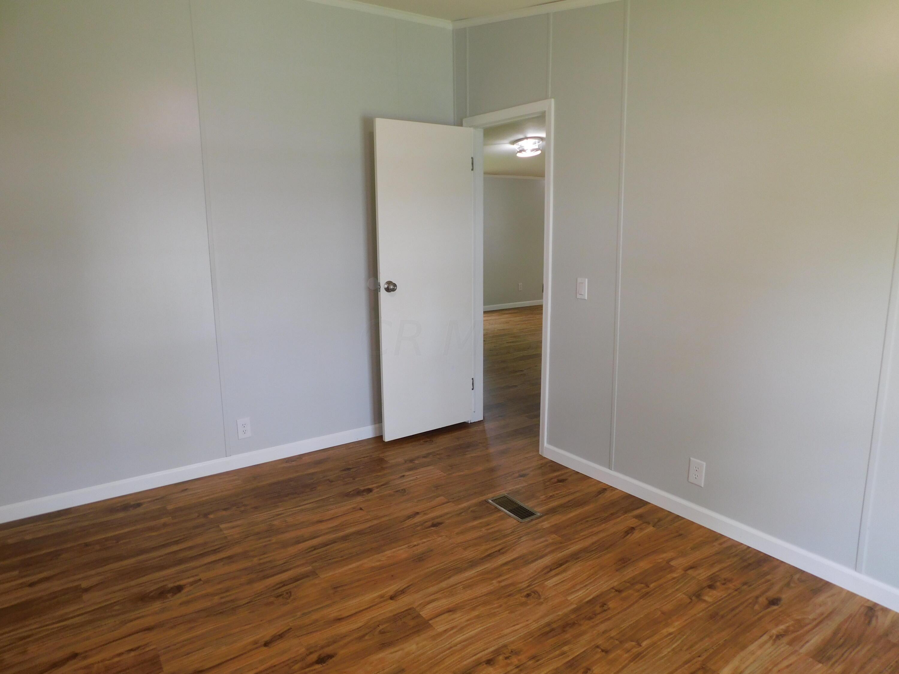 4711 Walnut Road, Unit LOT H8 Buckeye Lake, OH 43008 - Photo 25 of 42 Another view of Bedroom #3 leading into the hallway