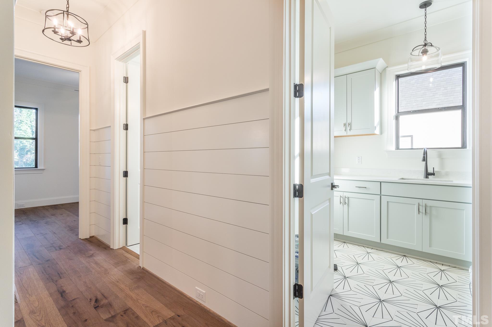 3820 Noremac Drive Raleigh, NC 27612 - Photo 21 of 46 a bathroom with a sink a vanity and a mirror