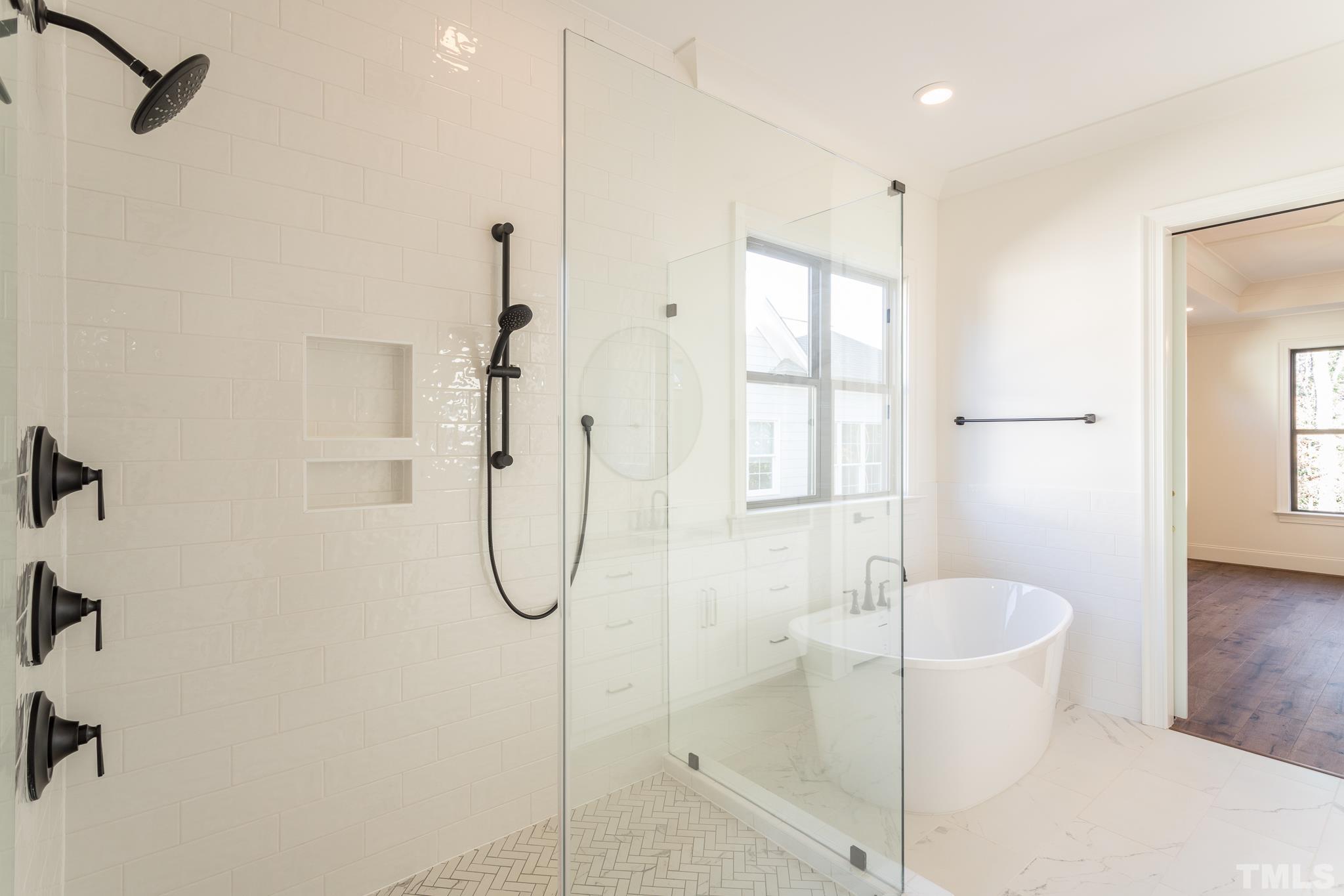 3820 Noremac Drive Raleigh, NC 27612 - Photo 24 of 46 a bathroom with a granite countertop shower a sink and a mirror