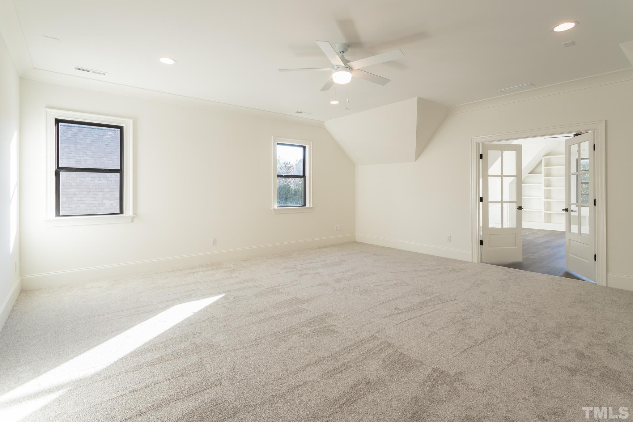 3820 Noremac Drive Raleigh, NC 27612 - Photo 29 of 46 an empty room with windows and fan