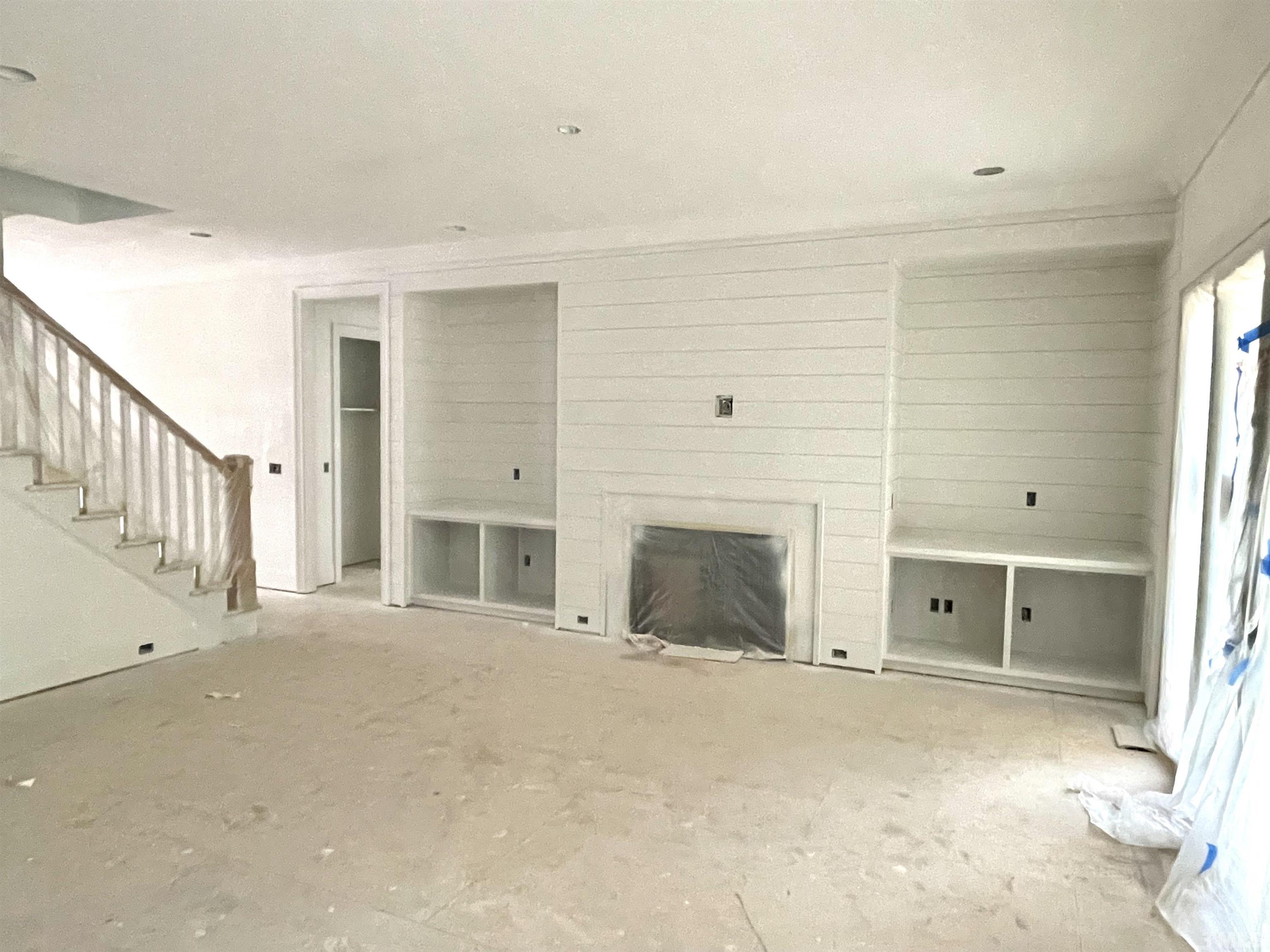 3820 Noremac Drive Raleigh, NC 27612 - Photo 4 of 46 a view of a livingroom with a fireplace cabinet and windows