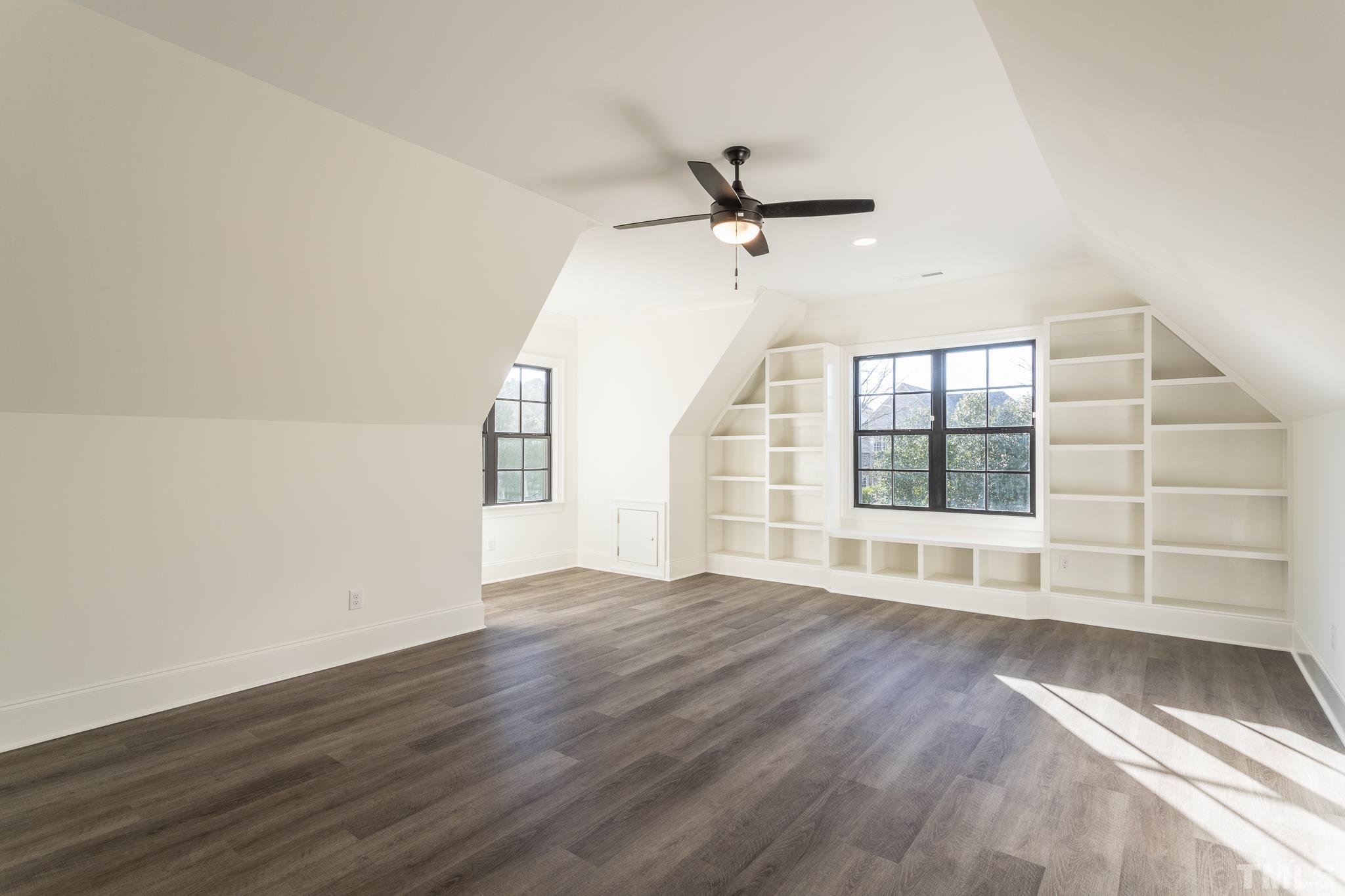 3820 Noremac Drive Raleigh, NC 27612 - Photo 32 of 46 a view of an empty room with a window and wooden floor