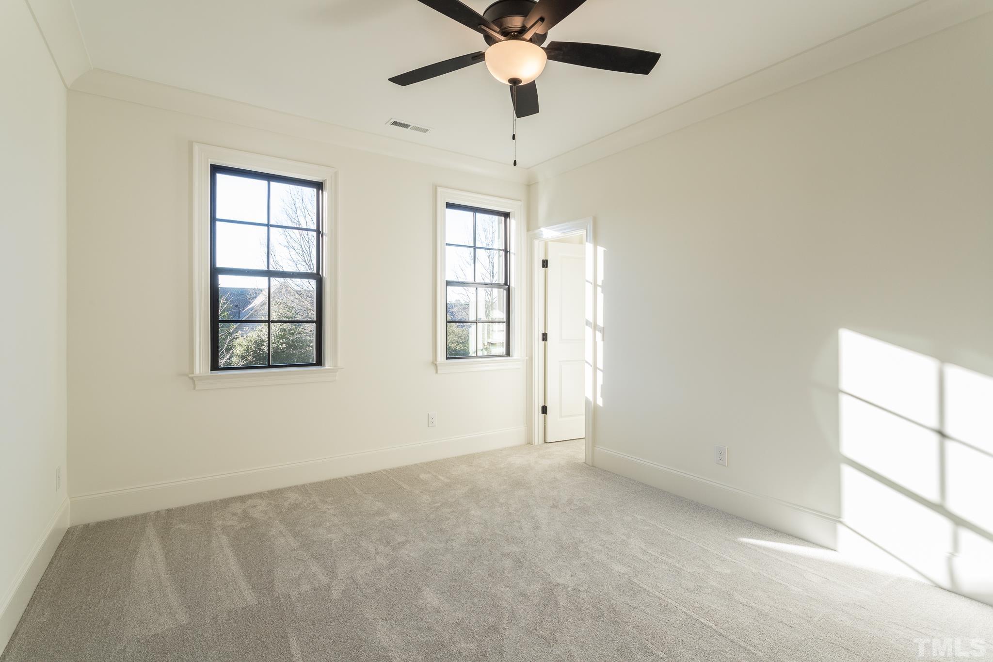 3820 Noremac Drive Raleigh, NC 27612 - Photo 35 of 46 an empty room with windows and fan