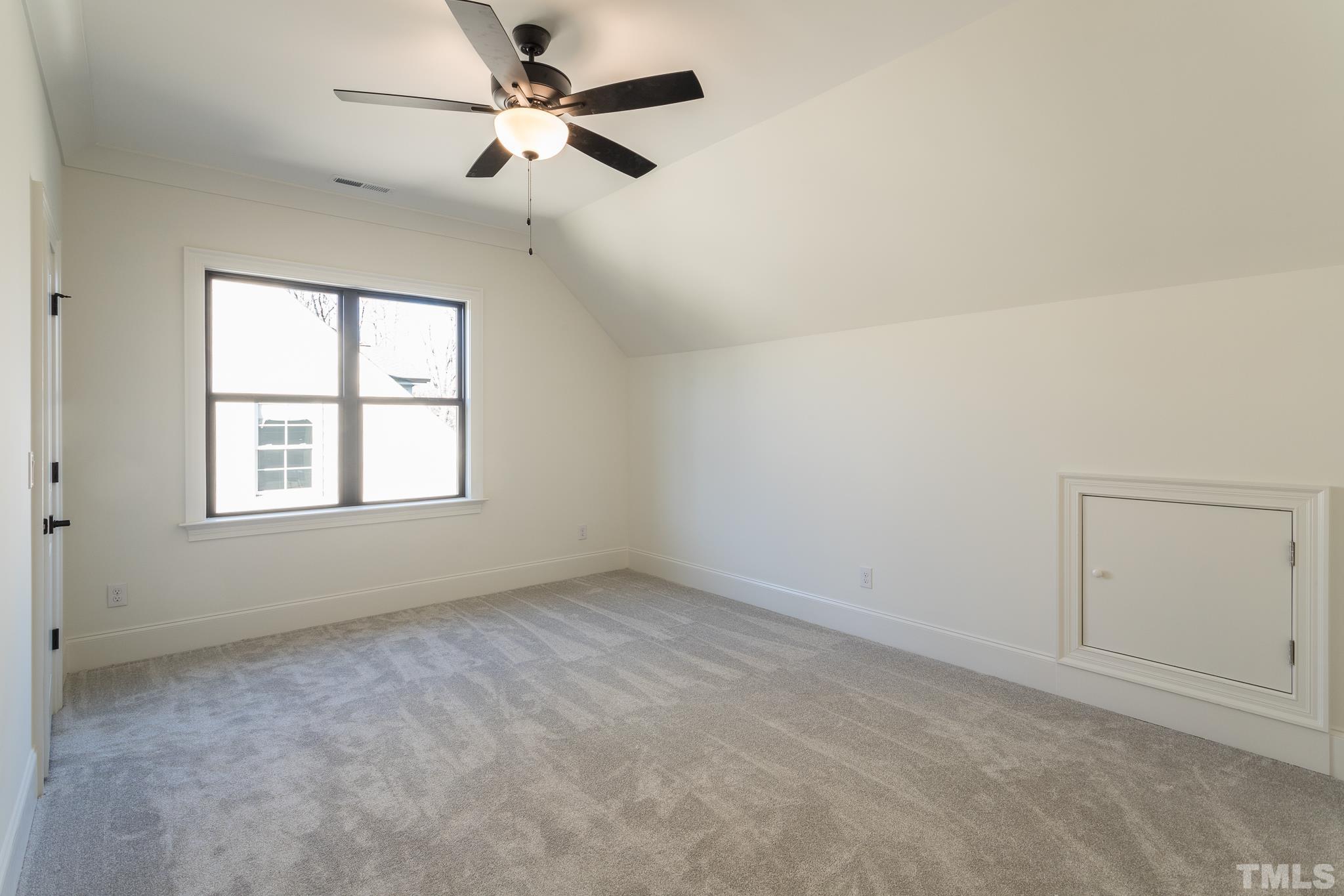 3820 Noremac Drive Raleigh, NC 27612 - Photo 39 of 46 an empty room with a window and a fan