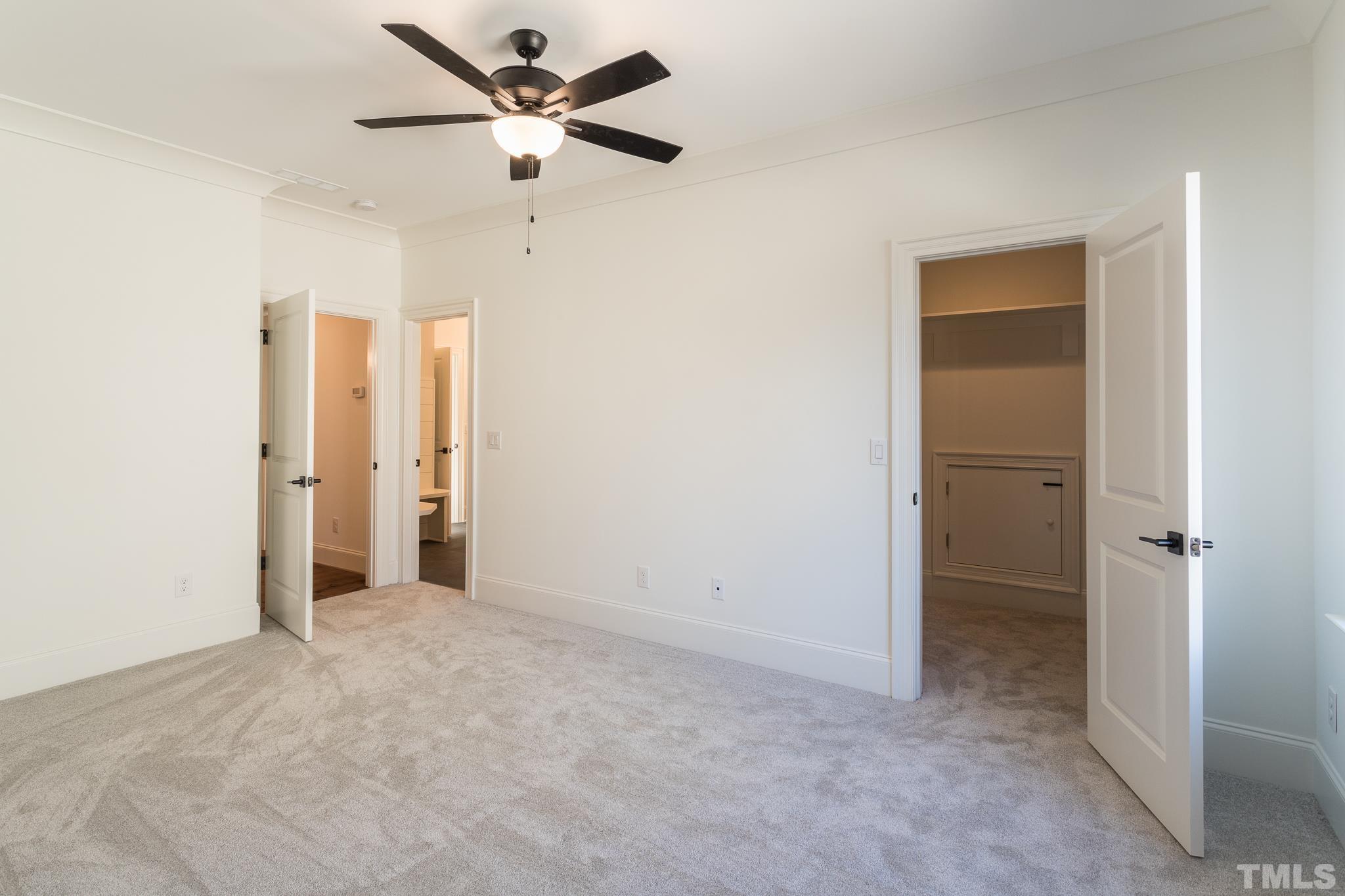 3820 Noremac Drive Raleigh, NC 27612 - Photo 40 of 46 an empty room with closet and a ceiling fan